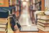 image of library books, laptop, graduation cap